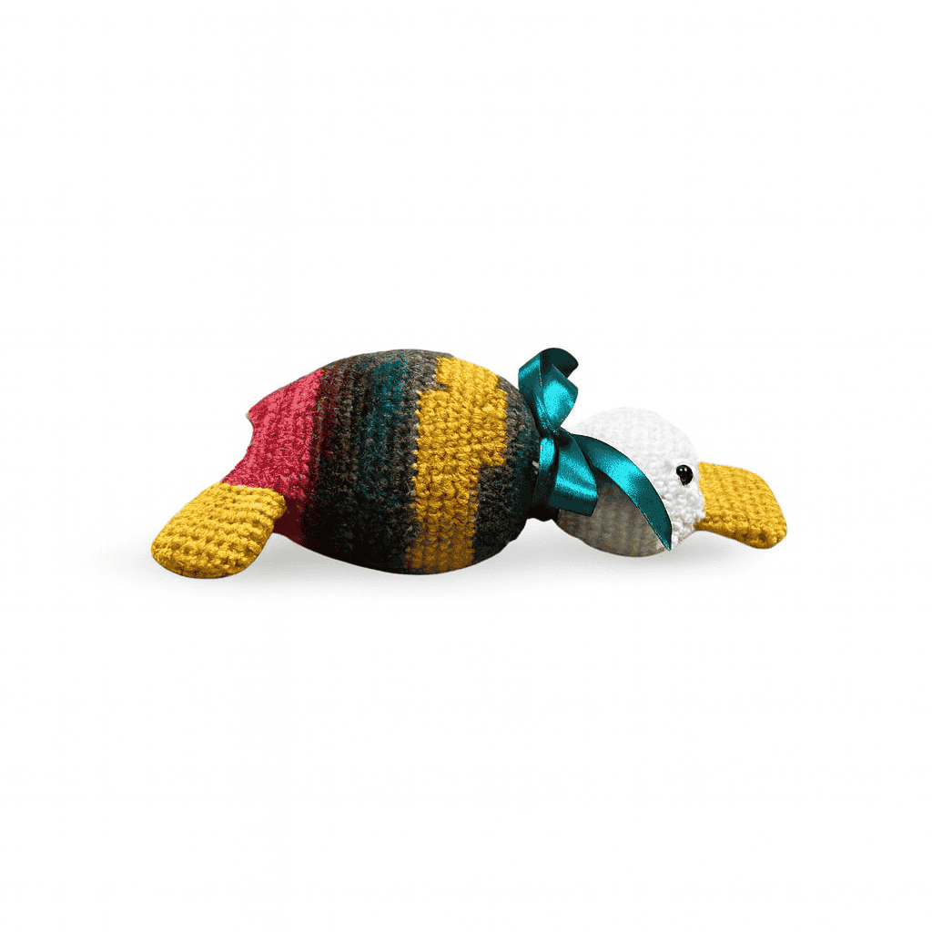 Colorful toy duck with a green ribbon