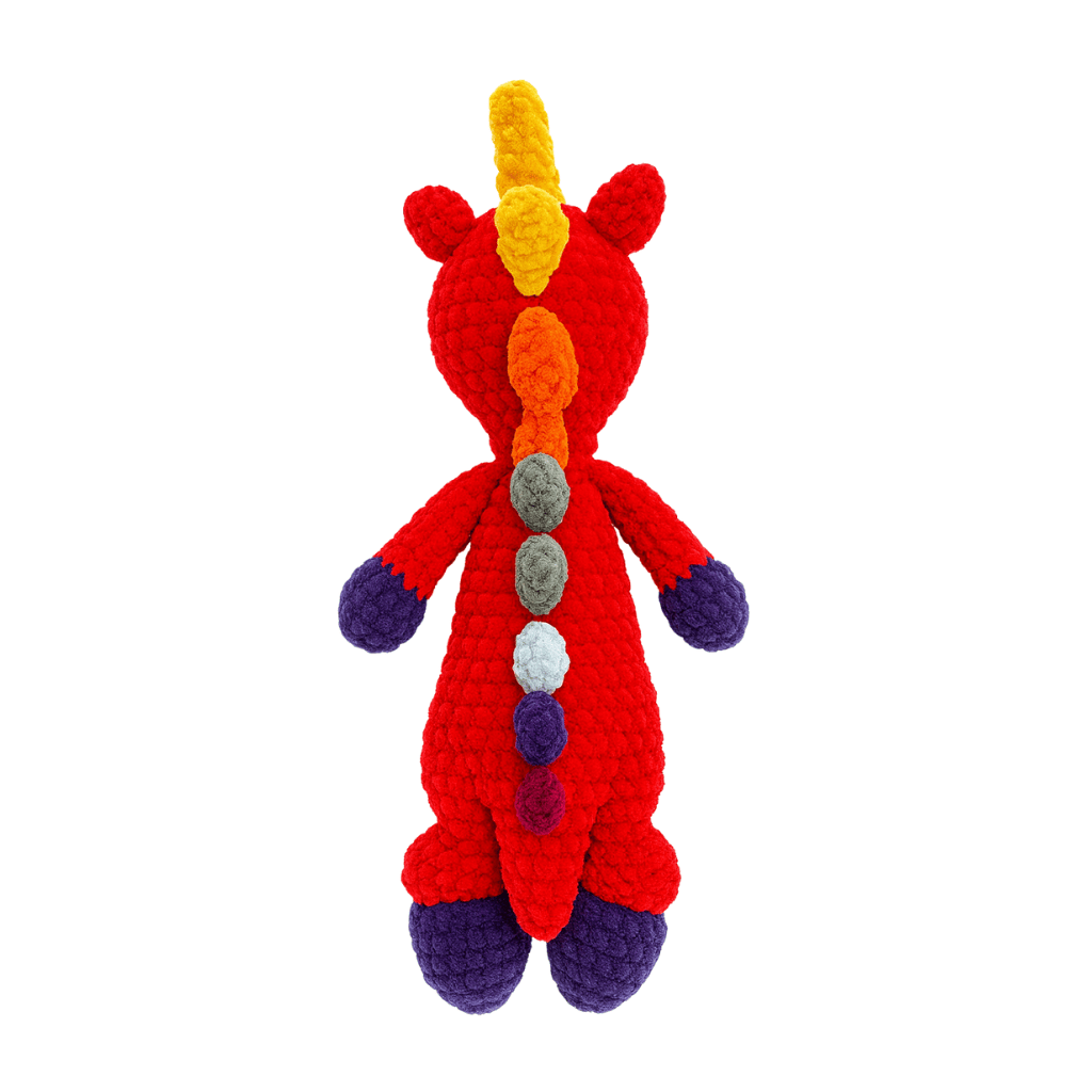 Crocheted dragon toy with a rainbow-colored mane