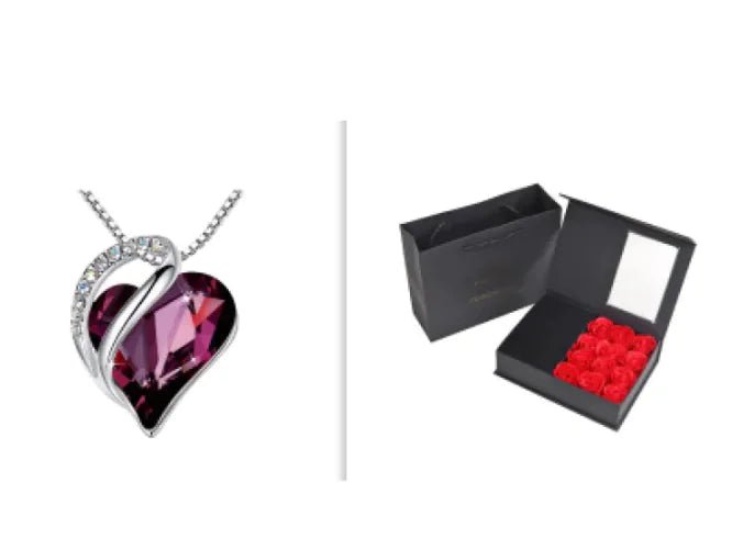 A set of a heart-shaped pendant necklace with a Dark Purple crystal pendant surrounded by smaller clear crystal and a box.