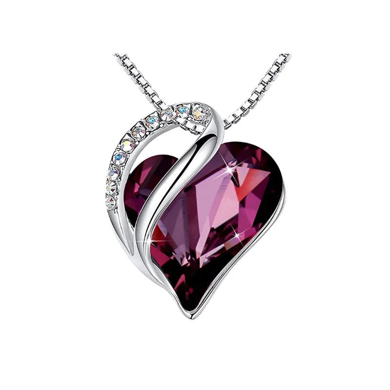 A heart-shaped pendant necklace with a Dark Purple crystal pendant surrounded by smaller clear crystals.