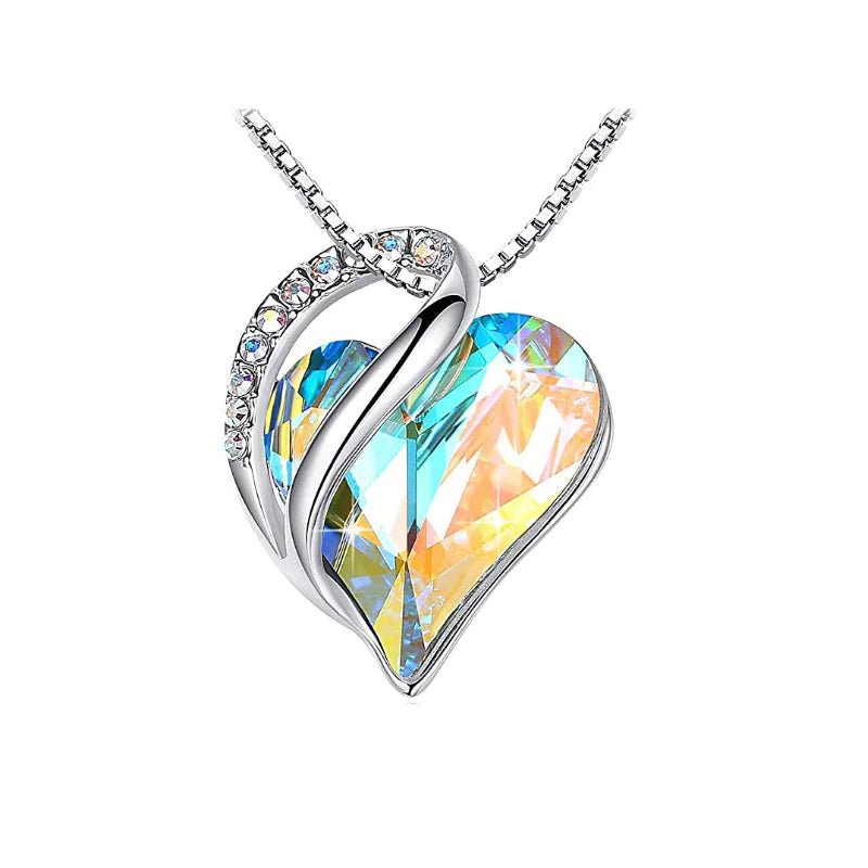 A heart-shaped pendant necklace with an Aurora crystal pendant surrounded by smaller clear crystal.