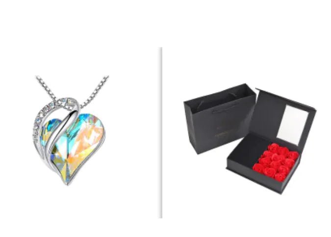 A set of a heart-shaped pendant necklace with an Aurora crystal pendant surrounded by smaller clear crystal and a box.