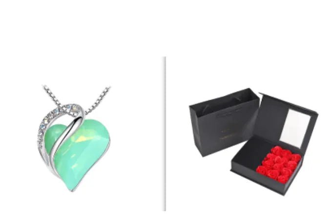 A set of a heart-shaped pendant necklace with a Mint crystal pendant surrounded by smaller clear crystal and a box.