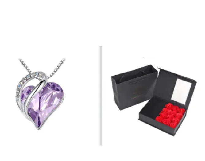 A set of a heart-shaped pendant necklace with a Lavender crystal pendant surrounded by smaller clear crystal and a box.