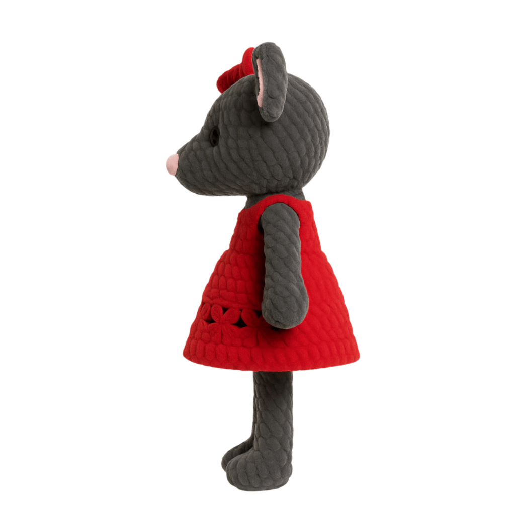 Handmade crochet doll resembling a mouse with a gray body, pink nose, big ears, and a red dress with a bow