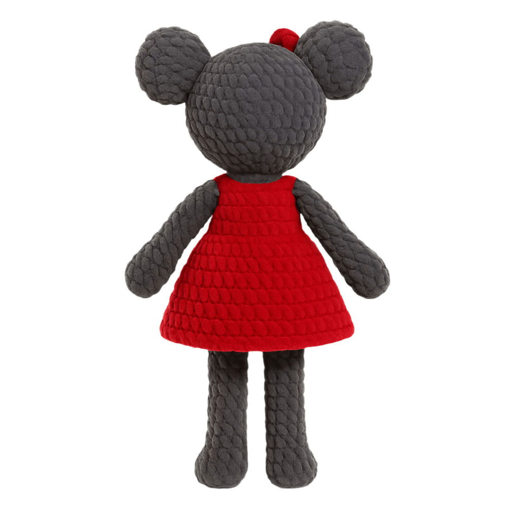 Handmade crochet doll resembling a mouse with a gray body, pink nose, big ears, and a red dress with a bow