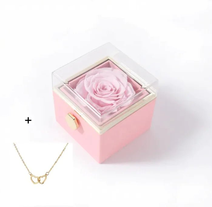 Pink box with a preserved rose and a gold necklace