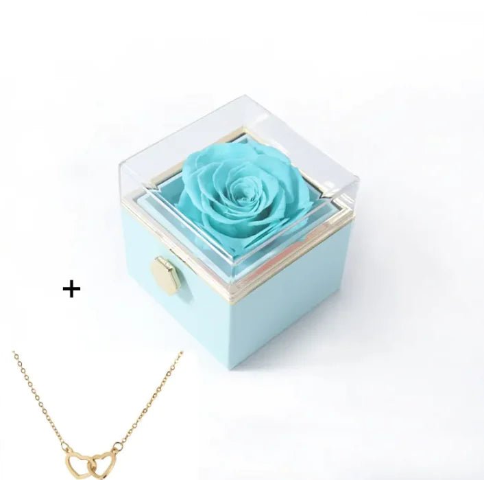 Light blue box with a preserved rose and a gold necklace