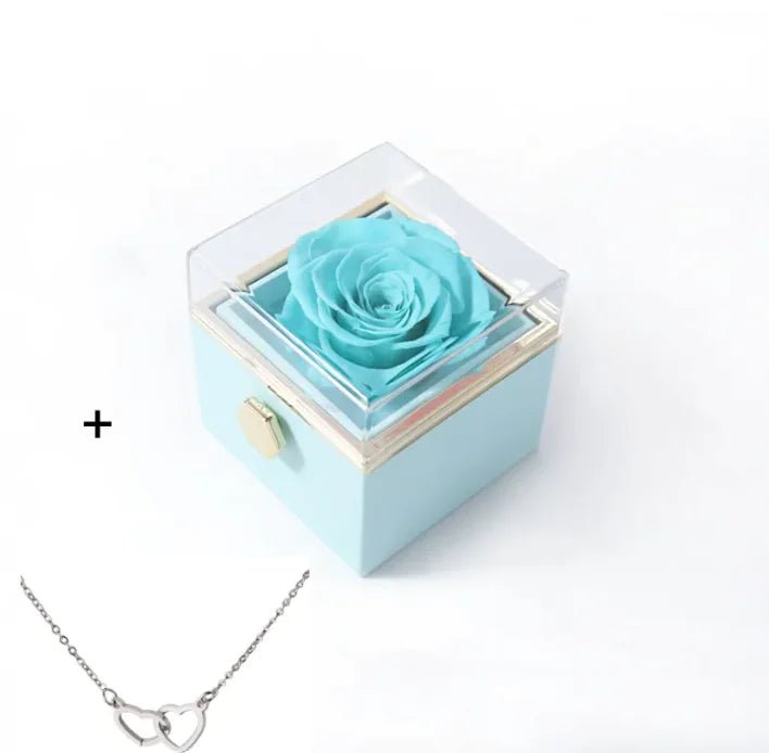Light blue box with a preserved rose and a silver necklace