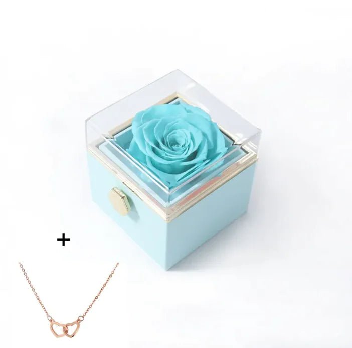 Light blue box with a preserved rose and a rose gold necklace