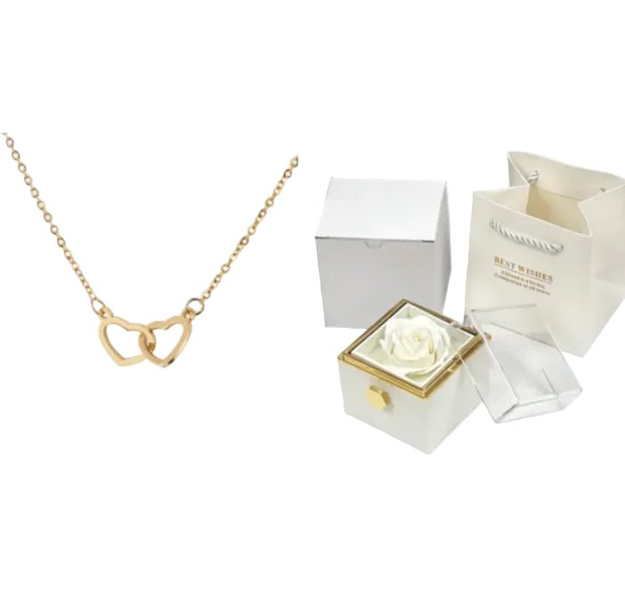 White rose in a box with a gold necklace