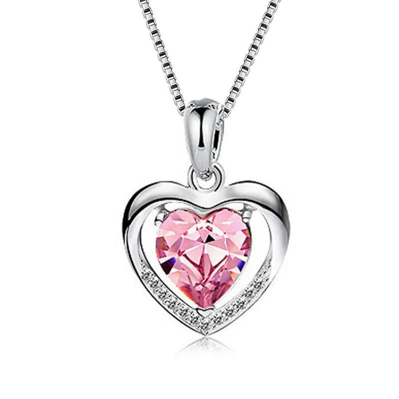 Pink Heart-shaped crystal pendant necklace on a silver chain.