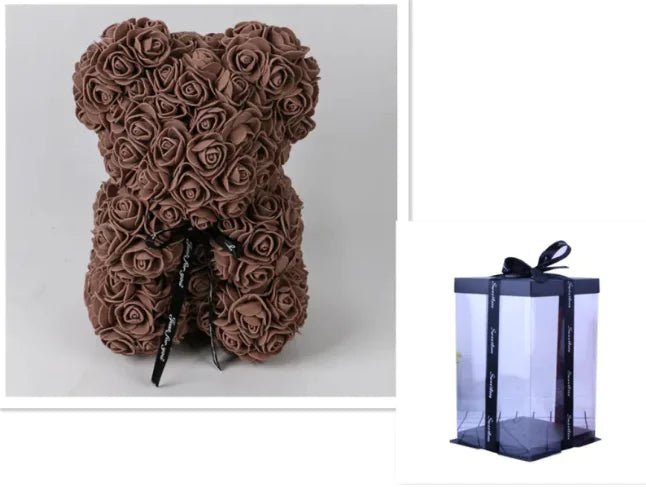 A teddy bear made from Coffee artifical roses, with a black ribbon bow, comes with a box.