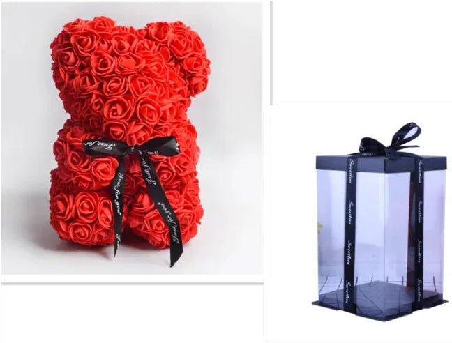 A teddy bear made from red artificial roses, with a black ribbon bow that comes with a box