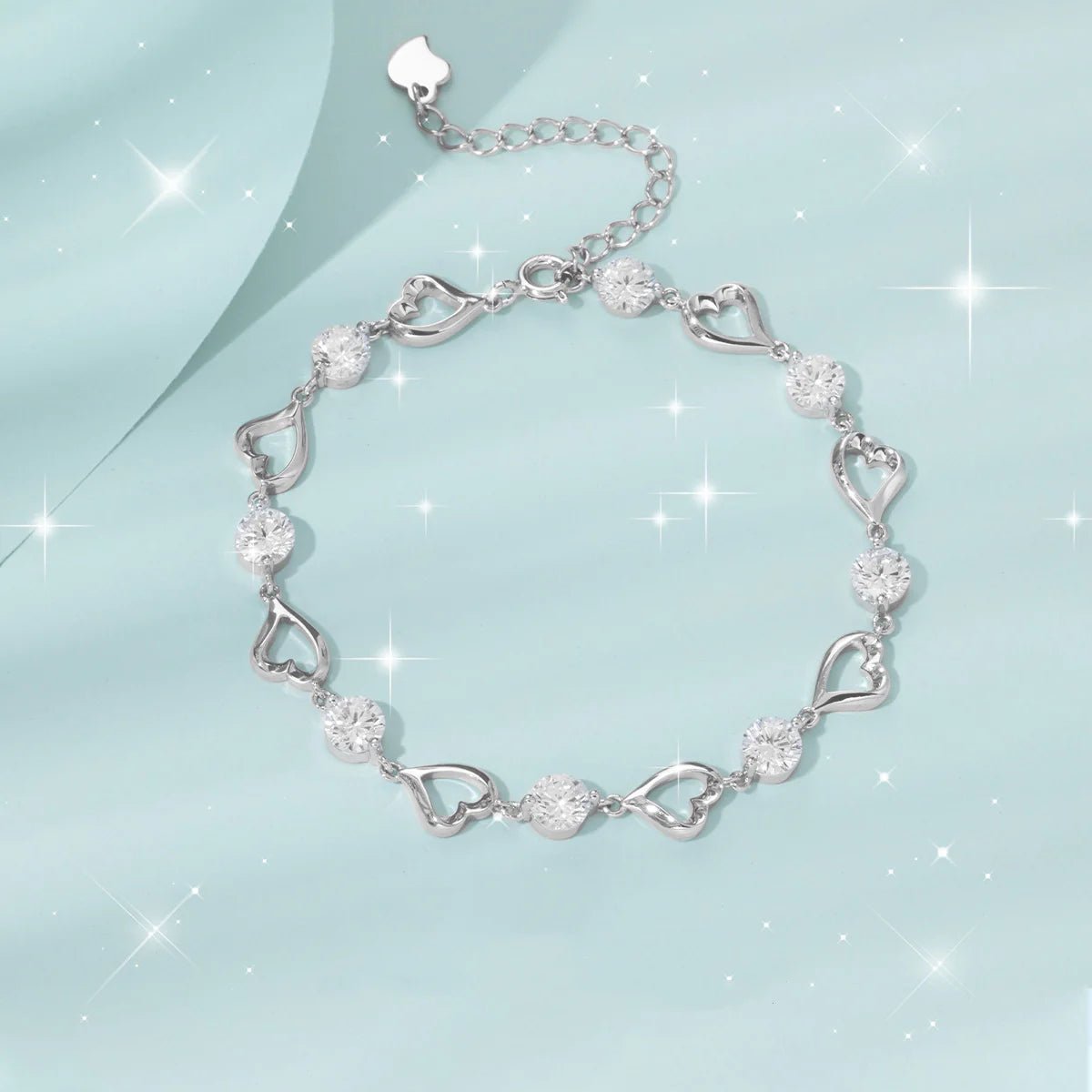 Silver heart bracelet with sparkling crystal accents and adjustable chain