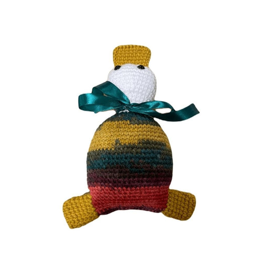 Colorful toy duck with a green ribbon