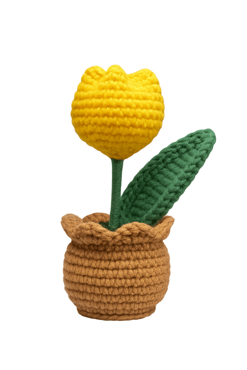 Crocheted yellow tulip in a brown pot with a green leaf