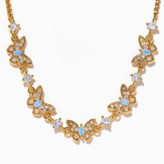 Gold butterfly necklace with blue accents
