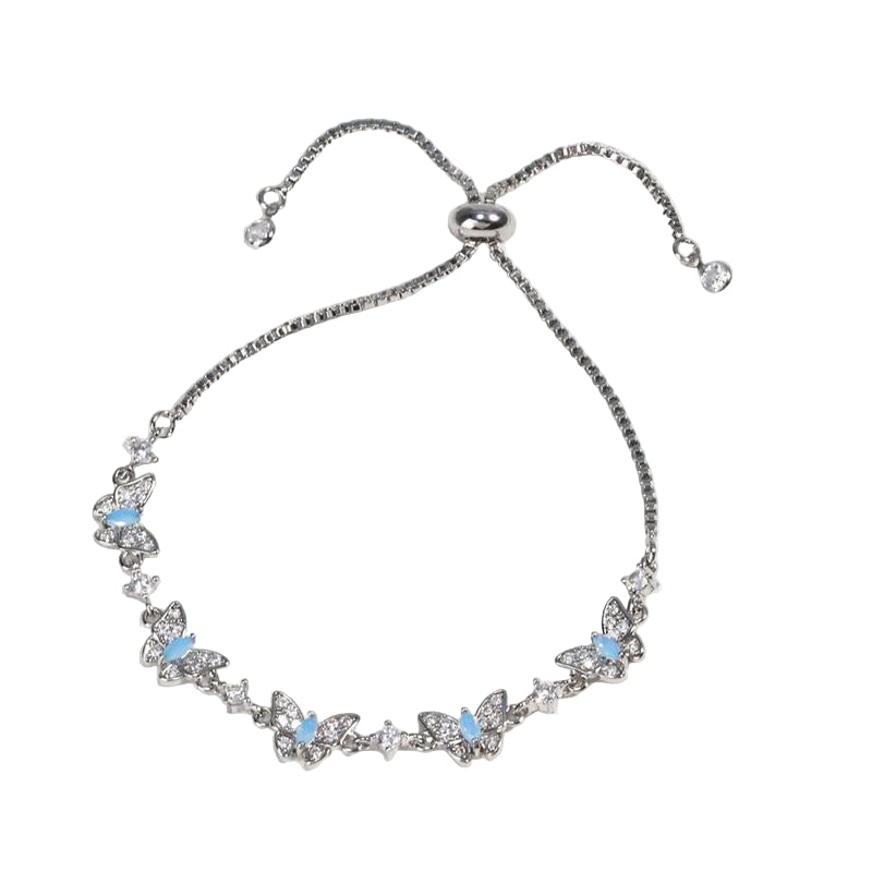 Silver bracelet with butterfly designs and blue stones 