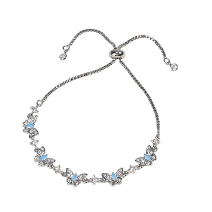 Silver bracelet with butterfly designs and blue stones 