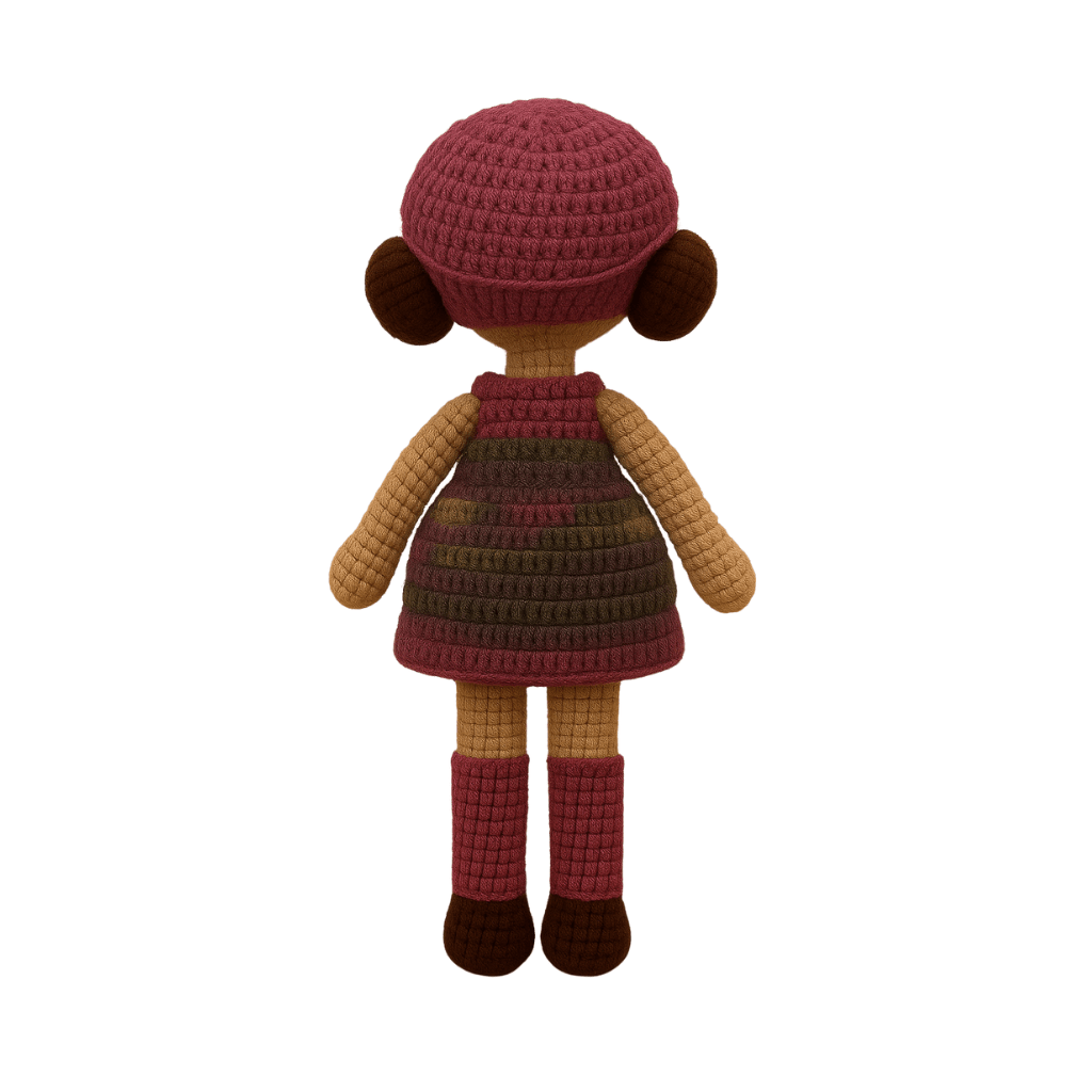 Handmade crochet doll with brown hair, wearing a purple striped dress and a matching beanie with a flower detail.