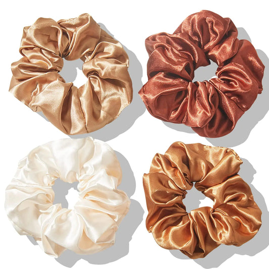A set of four silk satin scrunchies in brown, white and beige colors.