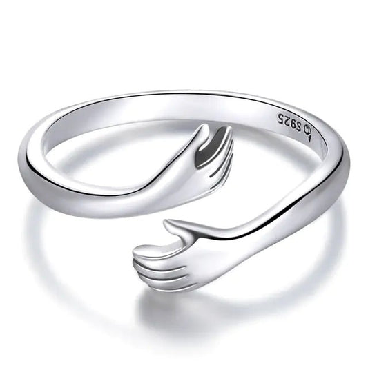 A 925 sterling silver ring with an open design resembling an embrace.