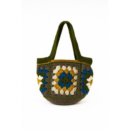 Crocheted bag with a geometric pattern with a green straps