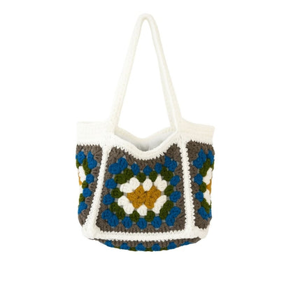 Crocheted bag with a colorful geometric pattern with white straps 