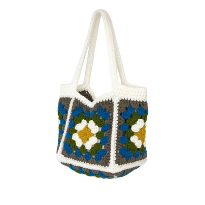 Crocheted bag with floral pattern with white straps