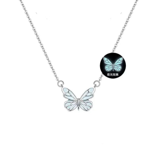a glow-in-the-dark butterfly pendant necklace made of titanium steel with a white and blue color scheme.