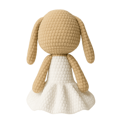 Toy dog with beige quilted texture and white dress on white background