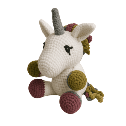 Crocheted unicorn toy with multicolored