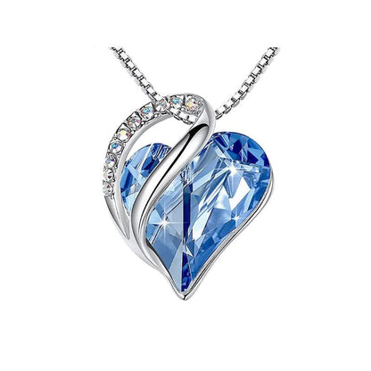 A heart-shaped pendant necklace with a Blue crystal pendant surrounded by smaller clear crystal.
