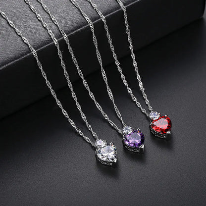 Three heart-shaped zircon necklaces with a white copper chain