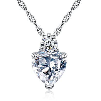 A heart-shaped zircon necklace with a white copper chain, featuring a prominent transparent zircon crystal