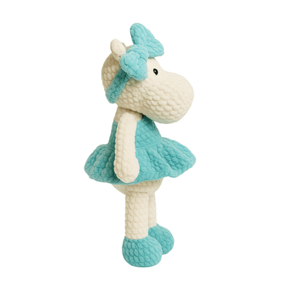 Handmade crochet doll in the shape of a hippopotamus wearing a teal dress and matching bow headband