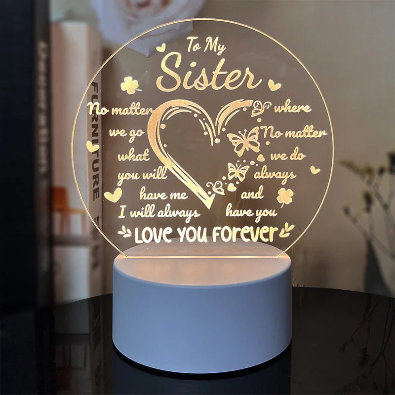 An engraved acrylic night light with a message to a Sister.