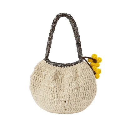 Beige crochet handbag with a braided handle and yellow flowers