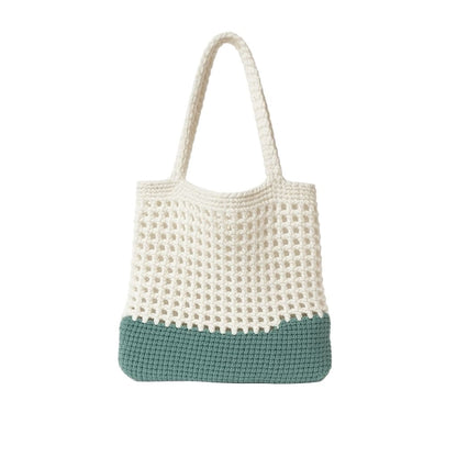 Crocheted bag with a white top and blue bottom 