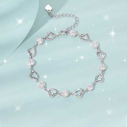 Silver heart bracelet with sparkling crystal accents and adjustable chain