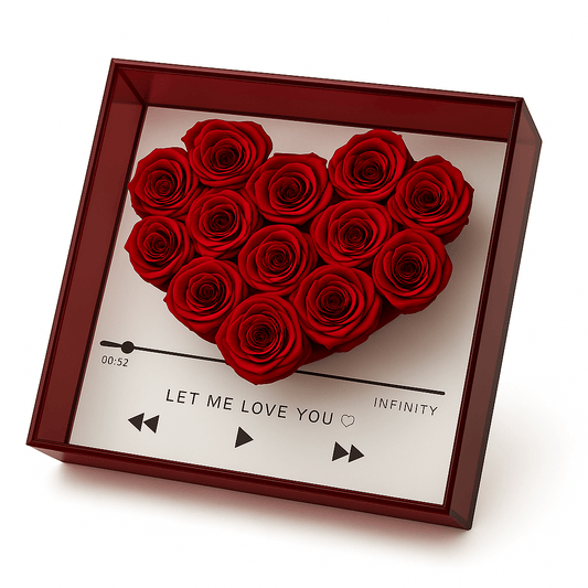 Heart-shaped arrangement of red roses in a decorative box with text and music player symbols.
